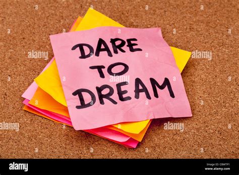 Dare To Dream Motivational Slogan Colorful Sticky Notes On Cork