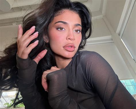 Kylie Jenner Flaunts Her Bra In See Through Dress As She Poses For Sexy Photo To Promote