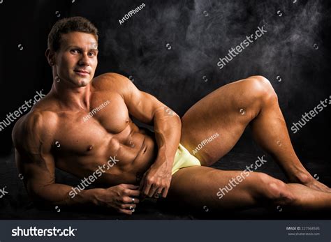 Attractive Shirtless Muscular Man Laying Down Foto Stock