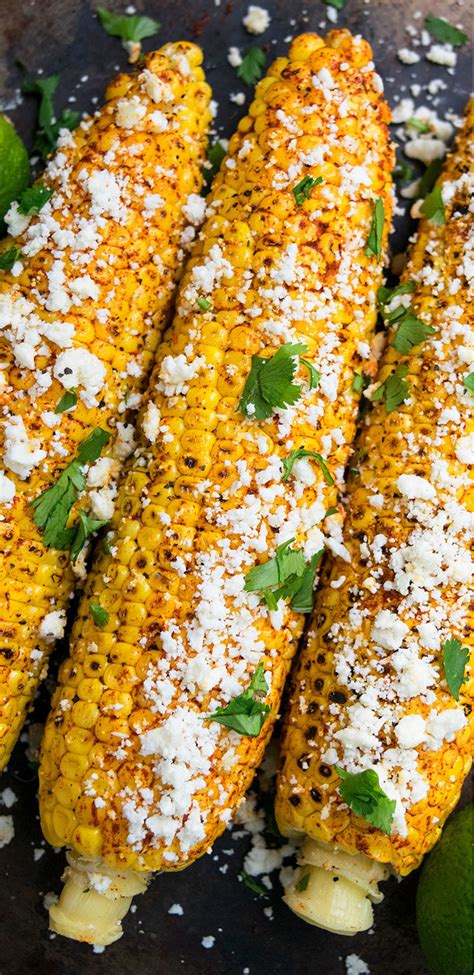 Mexican street corn is rubbed with garlic mayo, drizzled with lime juice, and sprinkled with cotija cheese and cilantro. Mexican Corn On The Cob (One Pan) | One Pot Recipes