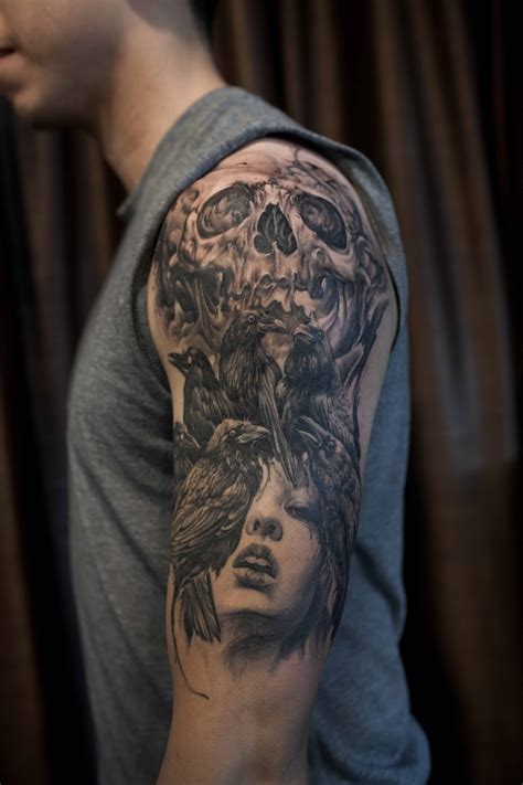 Half Sleeve Black And Grey Crows Skull And Portrait