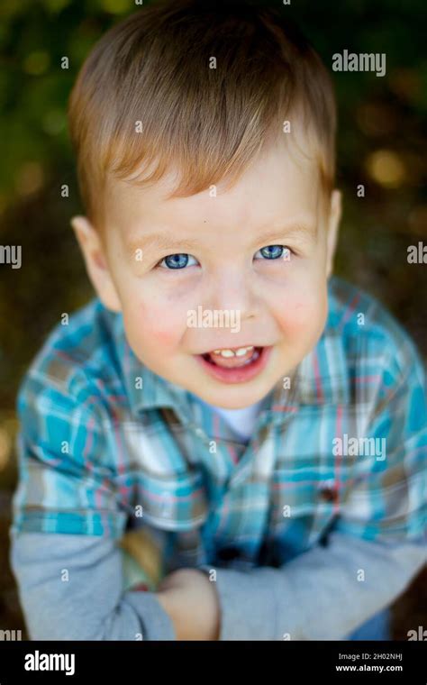 Sweet Baby Boy Closeup Portrait Of Child Isolated On Wood Background