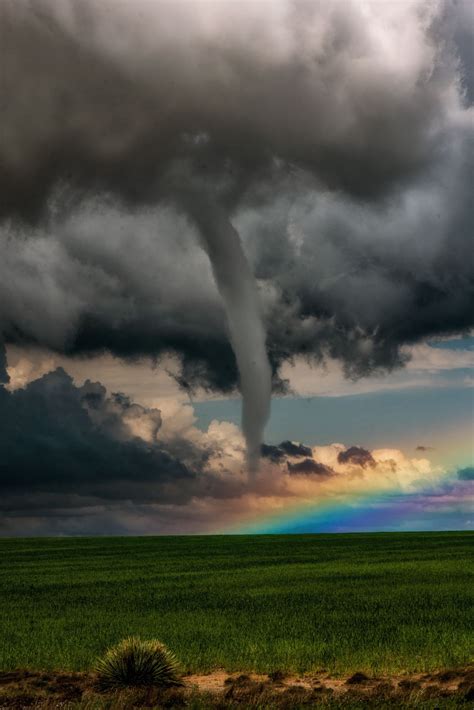 A Tornado In Front Of A Rainbow A Beautiful Shot Of A Tornado Forming