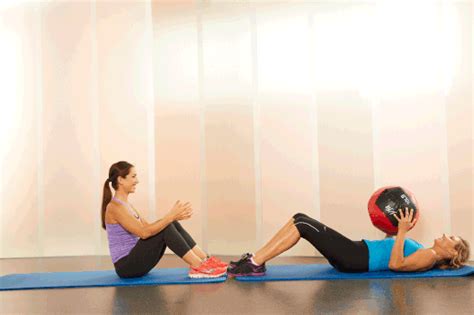 Two Women Are Doing Exercises On Exercise Mats