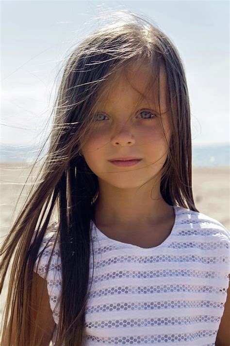 portrait of a tanned girl on the sandy beach photograph by elena saulich fine art america