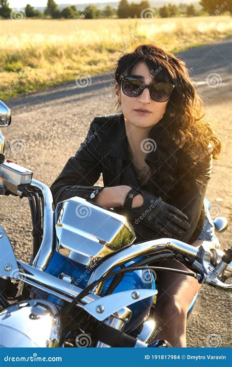 Brunette Girl Biker In Sunglasses Sitting On The Motorcycle Stock Photo Image Of Biker