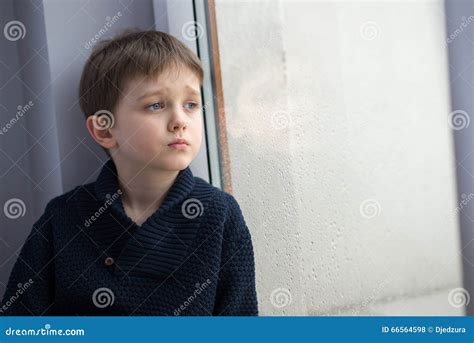 Sad 7 Years Boy Child Looking Out The Window Stock Photo Image Of