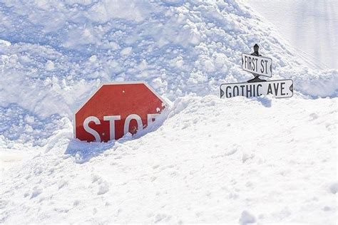 Deep Snow Covering Stop Sign In Downtown Crested Butte Colo © Design