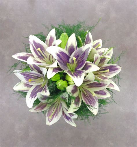Bouquets of wedding flowers can cost anywhere from $80 to over $200. Purple and white lily bridal bouquet by Nancy at Belton ...
