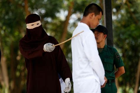 woman caned in public for having sex outside marriage…