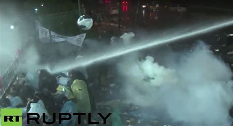 Tear Gas Water Cannon Turkish Police Raid Zaman Newspaper In Istanbul