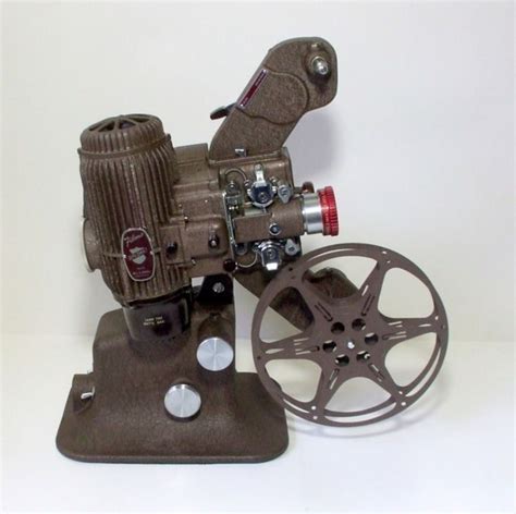 Vintage Bell And Howell 16mm Projector With Reel Model Filmo