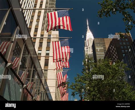 A Row Of American Flags And The Chrysler Building In Midtown Manhattan