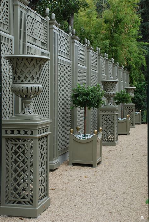 Versailles planter, french planters from l'orangerie of the palace of versailles, planter boxes, large outdoor planters, metal planters. Against the wall custom Treillage with curved planters ...