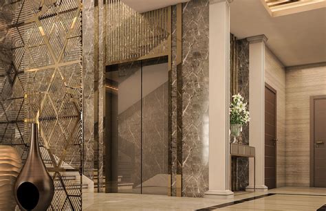 An Elegant Lobby With Marble Walls And Flooring Is Pictured In This