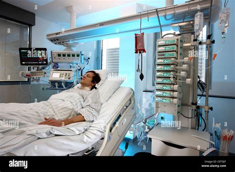 Intensive Care Unit In A Hospital A Patient Is Connected To Stock