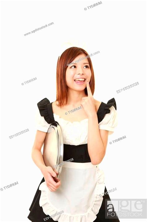 Portrait Of Young Japanese Woman Wearing French Maid Costume Stock