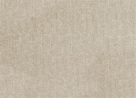 A Beige Background With Small White Dots