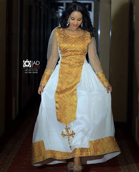 Clipkulture Lady In Beautiful White Habesha Kemis Dress With Gold Detail And Net Sleeves