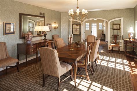 Formal Dining Room With An Impressive Area Rug And Great Fabric