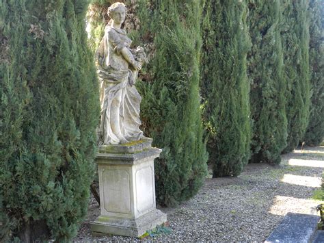 Stone Statue Amoung Cypress Trees In La Selva Villa Mansions Formal