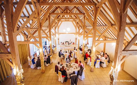 The bridge is over top of a river that flows all around the entire ceremony point. Wedding Venues in Hampshire | Barn Wedding Venues ...