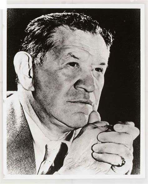 An Old Black And White Photo Of A Man With His Hand On His Chin Looking