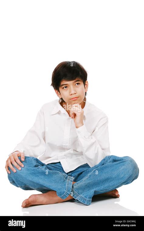Twelve Year Old Boy Sitting Thinking Stock Photo Alamy