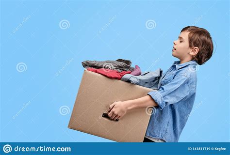Boy Carrying Box With Things For Charity Stock Image - Image of ...