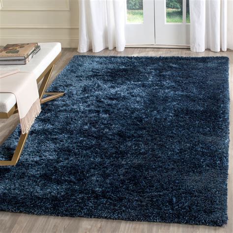 Featuring a stunning blue background with delicate cream colored accents, this rug is the. Plush Navy Blue Shag | Toronto Collection - Safavieh.com