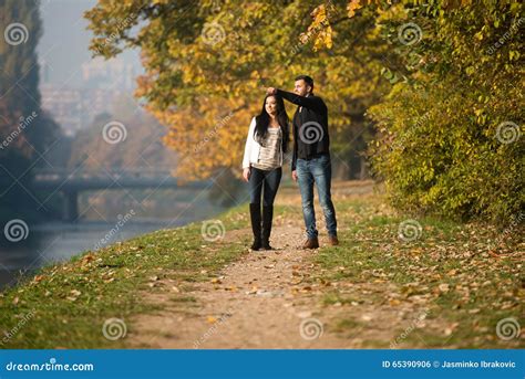 Young Couple Walking In Autumn Forest Stock Photo Image Of Love