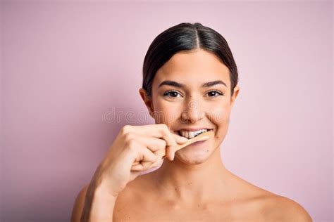 Young Beautiful Brunette Woman Brushing Her Teeth Using Tooth Brush And