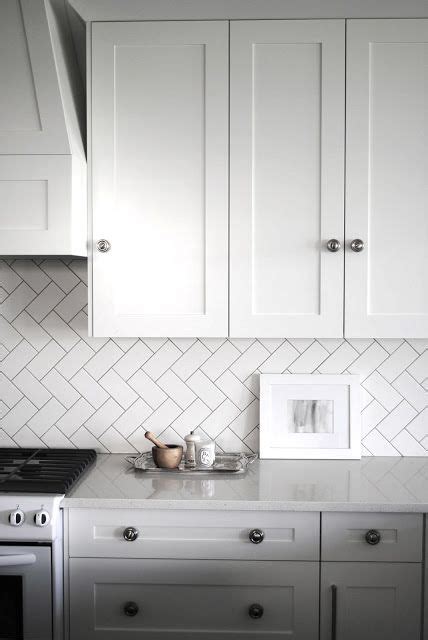 Embrace simplicity and choose white backsplash tiles. 17 Incredible Herringbone Tile Ideas - BELK Tile