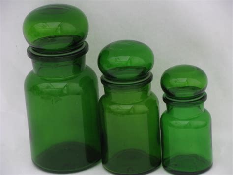 Or perhaps cheerful striped kitchen canisters to pick up your kitchen colors? Retro green glass kitchen canisters, airtight seal ...