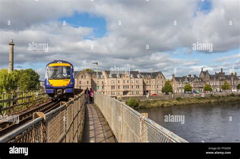 A Train Crosses The River Tay On The Friarton Bridge In The City Of
