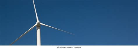 Wind Turbine Against Blue Sky Background Stock Photo 7635271 Shutterstock