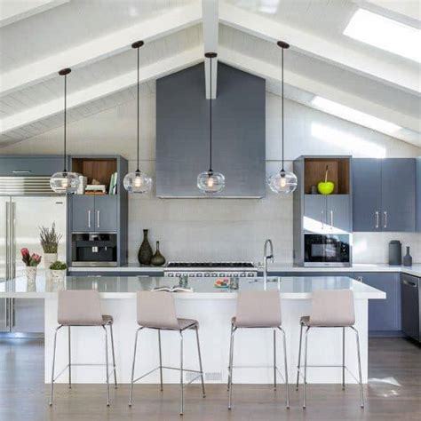 We love the way that this kitchen combines its cathedral ceiling with beautiful craftsman elements. Top 50 Best Grey Kitchen Ideas - Refined Interior Designs