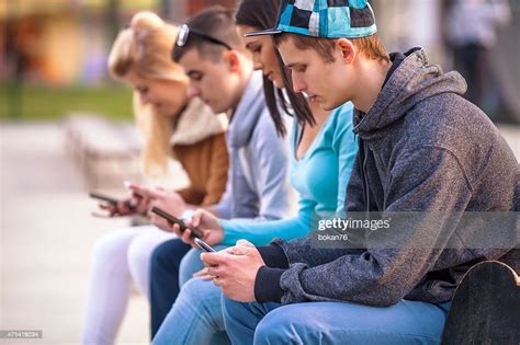 Teenagers Using Mobile Phones High Res Stock Photo Getty Images