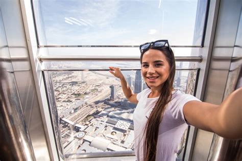 Premium Photo Young Pretty Woman Take Selfie On The Top On The Burj
