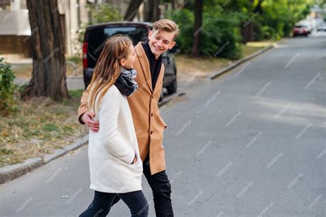 Premium Photo Couple Walking In The Street Together Hugging Casual Date Youth Lovers Leisure