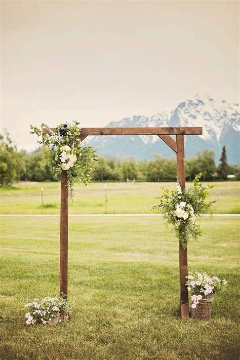 Jordan And Wrangels Wedding In Palmer Alaska Wedding Arch Greenery Wedding Arch Rustic