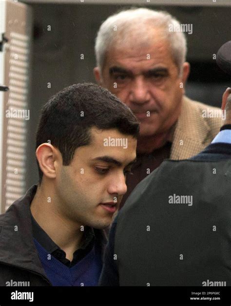 Hamed Shafia Front And His Father Mohammad Shafia Are Escorted Into The Frontenac County