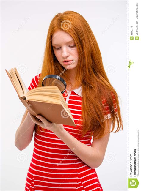 Concentrated Redhead Young Female Reading Book Using Magnifier Glass Stock Image Image Of