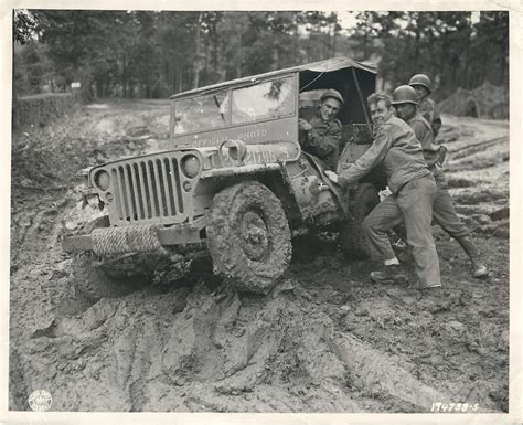 Us Soldiers Work To Free Jeep Mired In The Mud Of Germany October