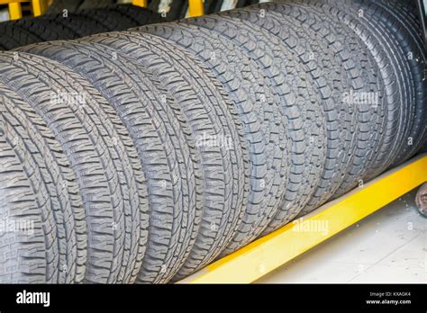 Car tires at warehouse in tire store Stock Photo - Alamy