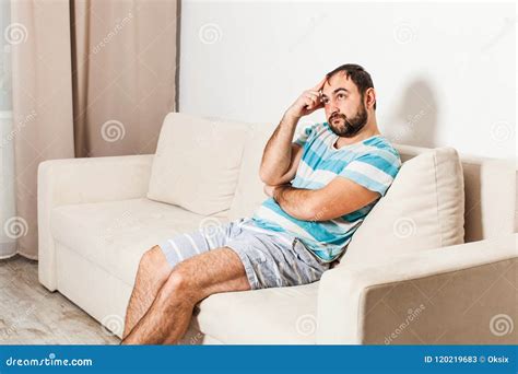 Thoughtful Man Sitting On The Couch Stock Image Image Of Portrait