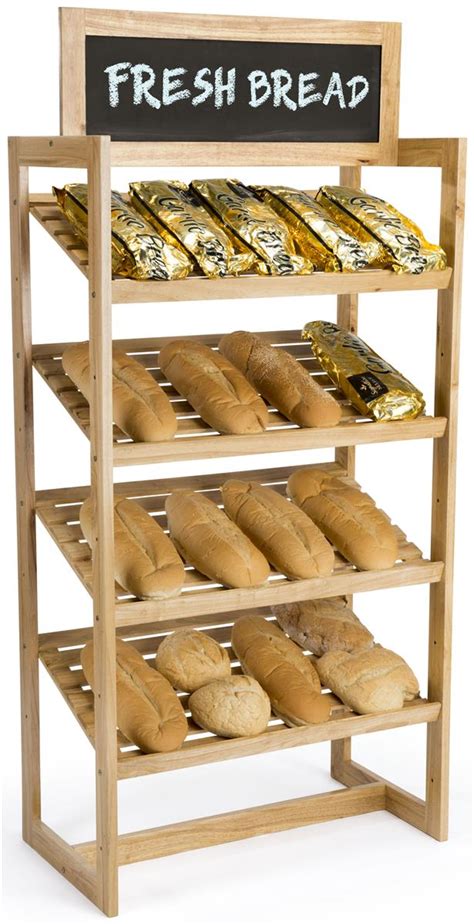 Fresh Bread Is Displayed On A Wooden Shelf With A Chalkboard Sign That