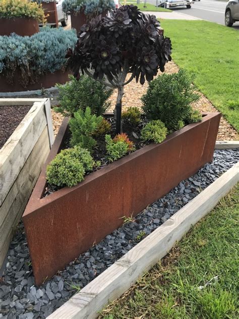 Corten Raised Garden Beds Triangular Breakwater Metaland