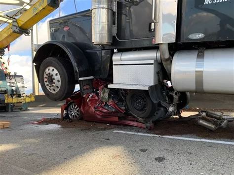 Woman Survives After Her Car Was Crushed By 18 Wheeler Truck