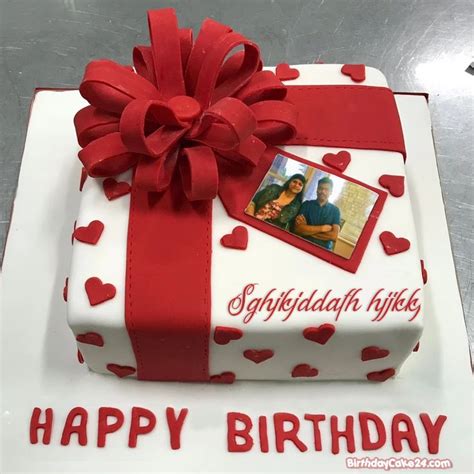 A Birthday Cake Decorated With Hearts And A Photo